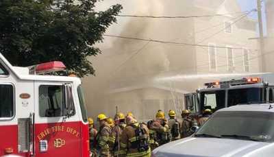 firefighters outside of a house fire