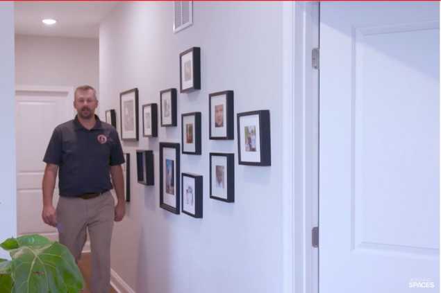 man standing in hallway