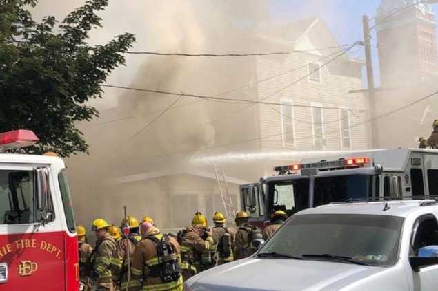 firefighters outside of a house fire