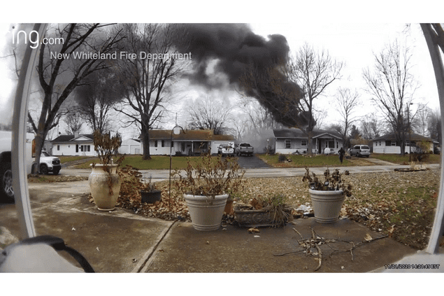 ring camera image of house on fire