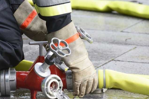 firefighter disconnecting a fire hose