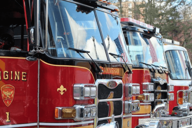 front of three fire engines