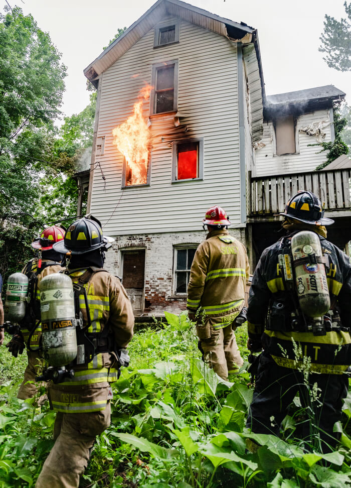 firefighters fighting house fire